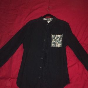 On the Byas navy jean button up shirt.